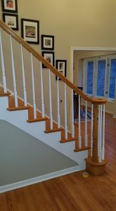 staircase inside the house with photoframes on the wall